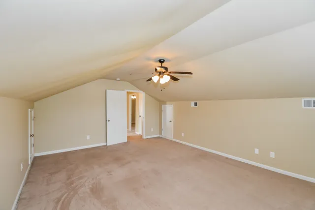 a view of a big room with carpet