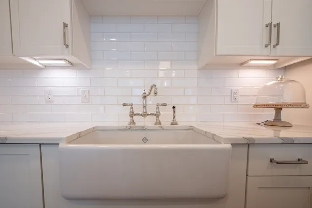 a white bath tub sitting in a bathroom