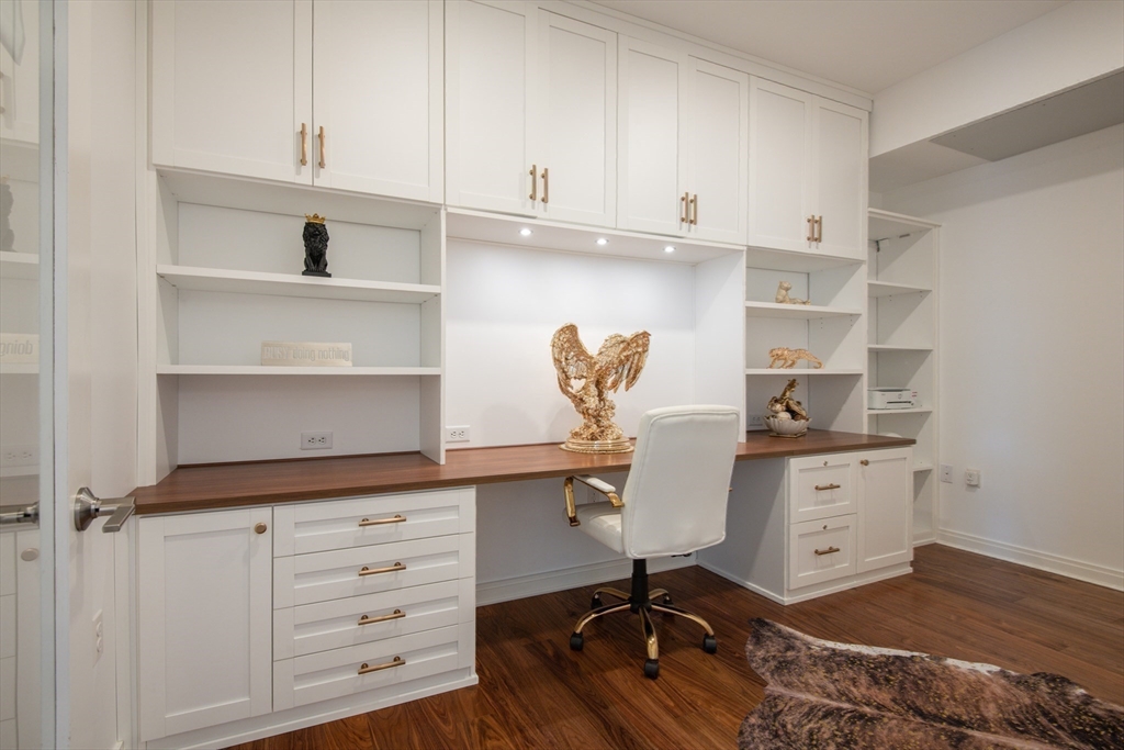 3531 Washington Street, Unit 316 Boston, MA 02130 - Photo 15 of 40 a kitchen with cabinets appliances and a wooden floor
