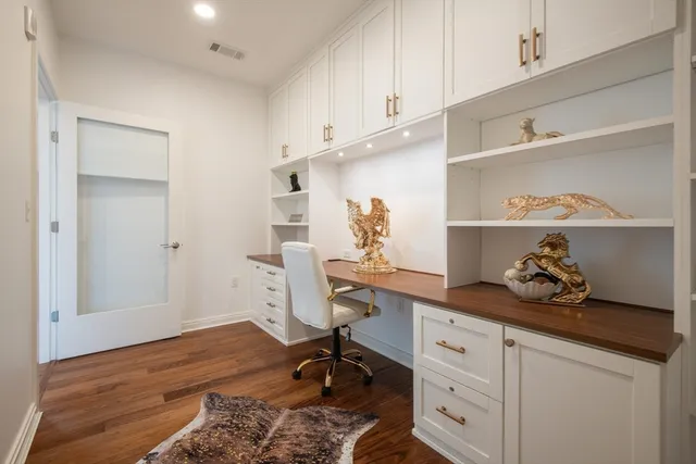 a view of a workspace with furniture