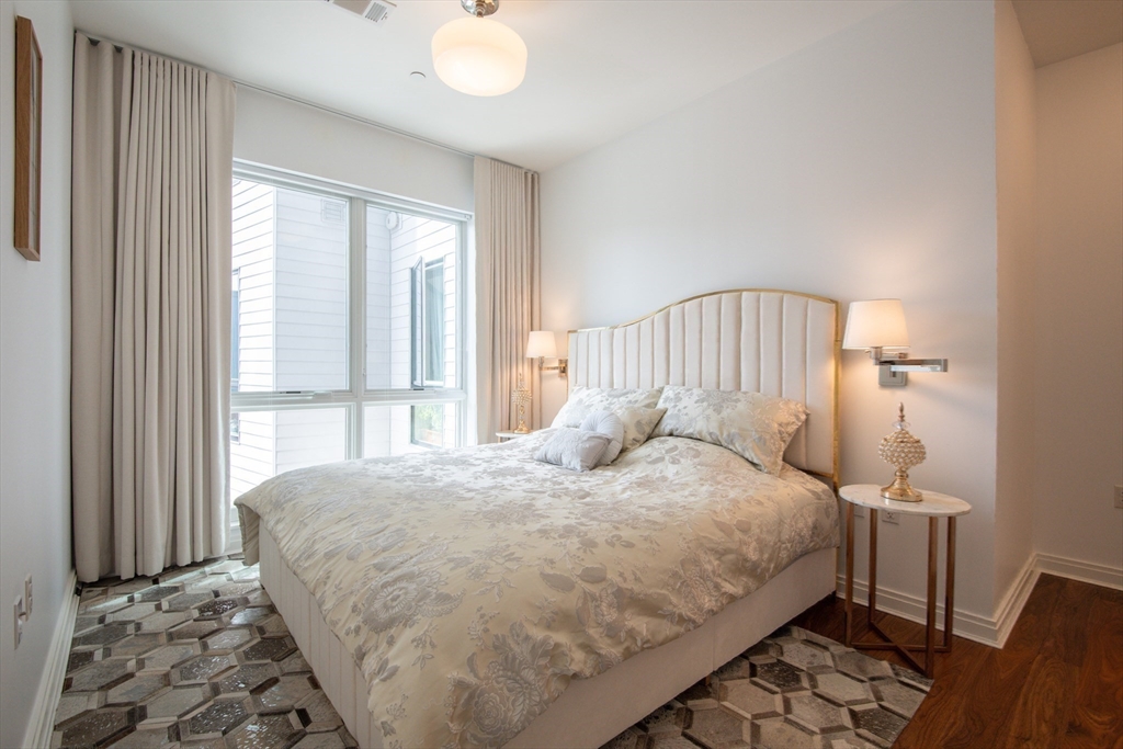 3531 Washington Street, Unit 316 Boston, MA 02130 - Photo 17 of 40 a bedroom with a bed and a window