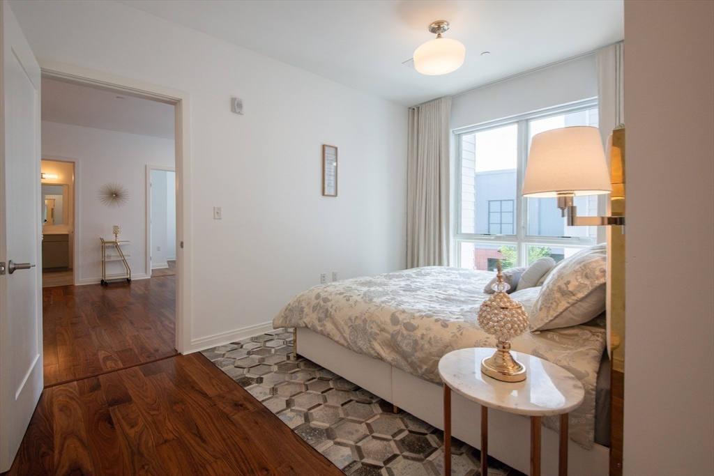 3531 Washington Street, Unit 316 Boston, MA 02130 - Photo 18 of 40 a living room with furniture and a large window