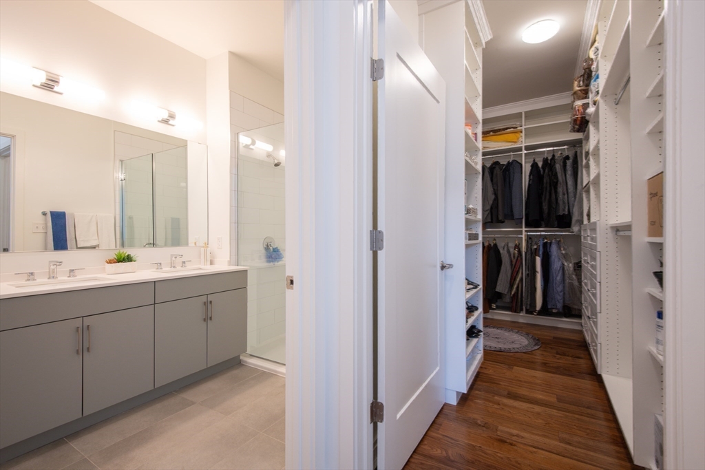 3531 Washington Street, Unit 316 Boston, MA 02130 - Photo 21 of 40 a bathroom with a double vanity sink and a mirror