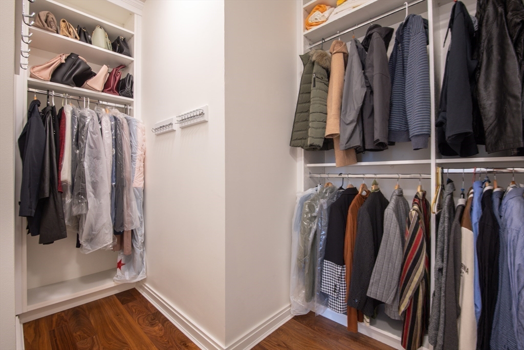 3531 Washington Street, Unit 316 Boston, MA 02130 - Photo 22 of 40 a view of walk in closet with clothes and shoes
