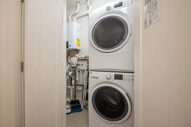 a close up view of a washer and dryer in a utility room