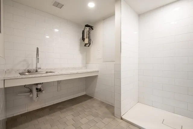 a bathroom with a sink and mirror