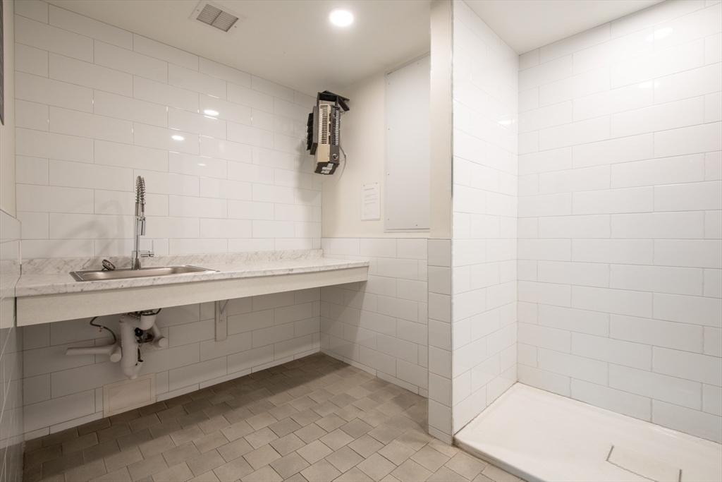 3531 Washington Street, Unit 316 Boston, MA 02130 - Photo 33 of 40 a bathroom with a sink and mirror