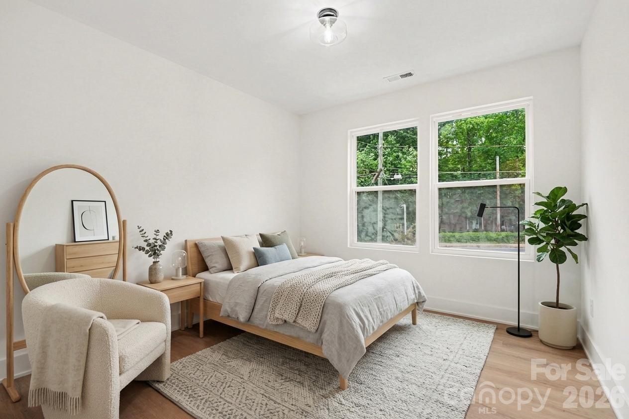 7521 Lawyers Road Charlotte, NC 28227 - Photo 7 of 35 a bedroom with a bed and a window