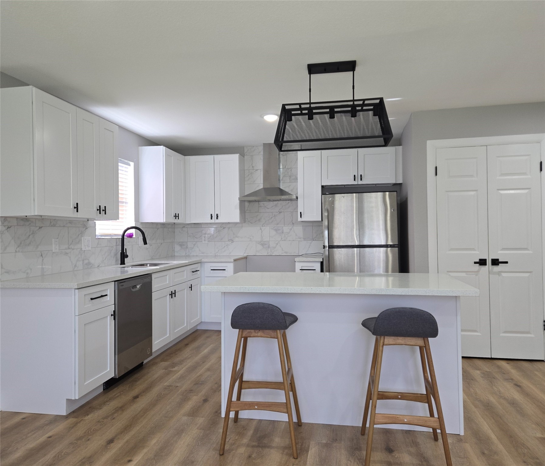 6502 Trail Valley Way Houston, TX 77086 - Photo 11 of 24 a kitchen with stainless steel appliances granite countertop a stove refrigerator sink and cabinets
