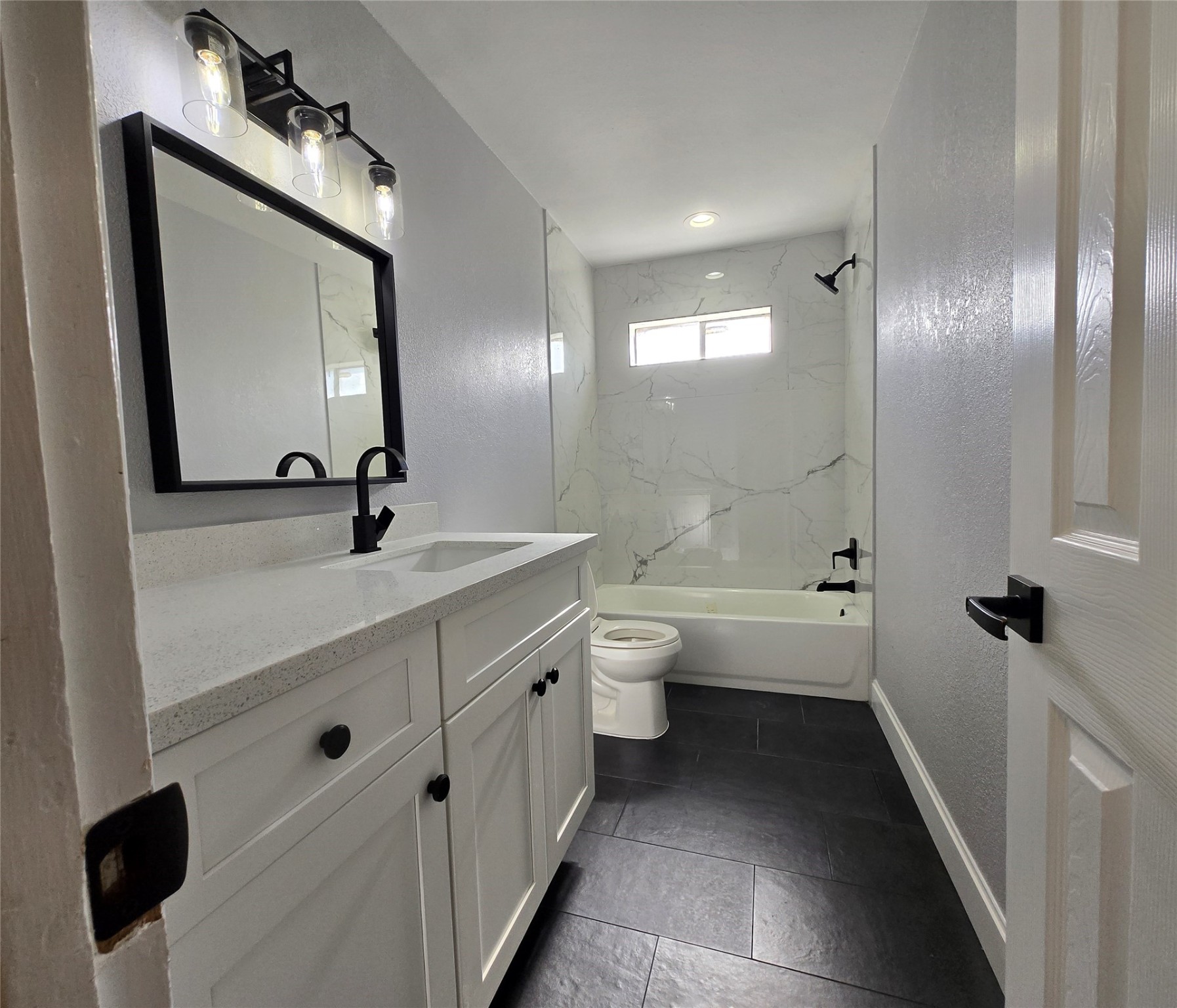 6502 Trail Valley Way Houston, TX 77086 - Photo 17 of 24 a bathroom with a double vanity sink toilet mirror and bathtub