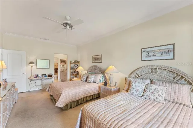 a bedroom with two beds and painting on the wall