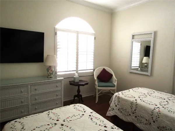 a bedroom with bed and window