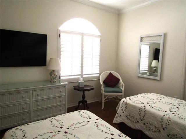 a bedroom with bed and window