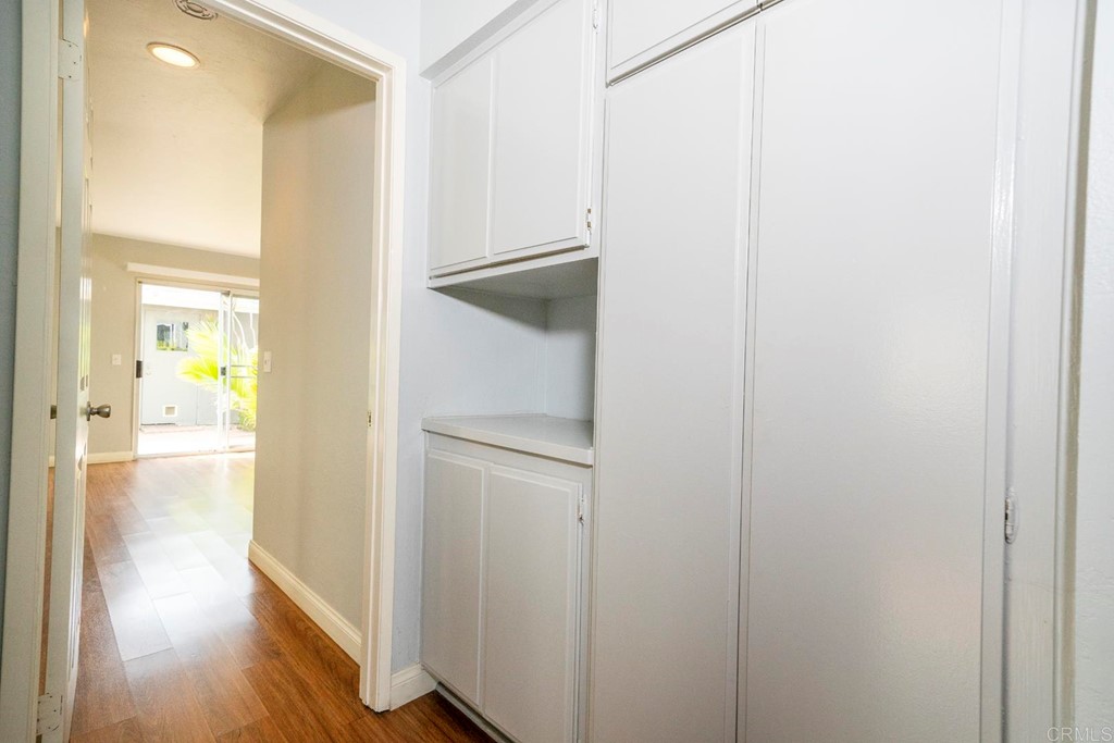 249 Fredricks Avenue Oceanside, CA 92058 - Photo 12 of 31 a view of a hallway with wooden floor