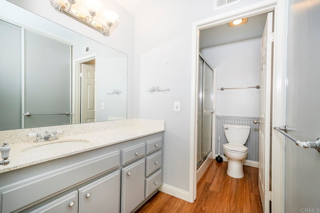249 Fredricks Avenue Oceanside, CA 92058 - Photo 16 of 31 a bathroom with a sink a toilet and shower