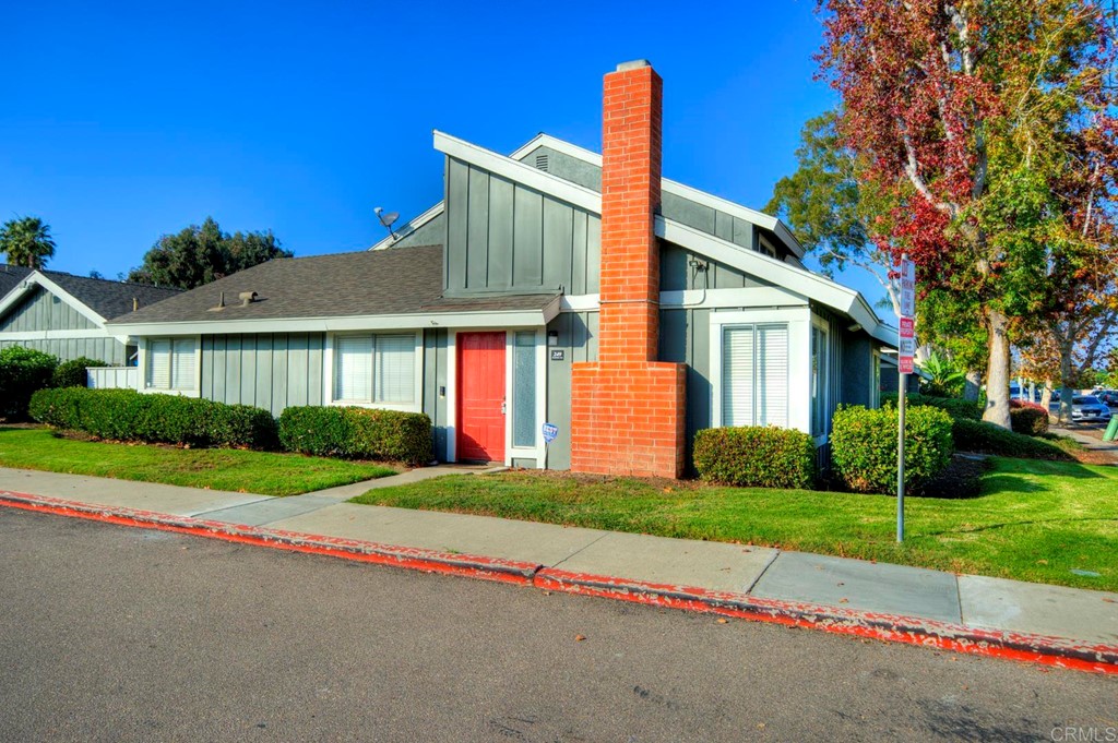249 Fredricks Avenue Oceanside, CA 92058 - Photo 2 of 31 a front view of a house with a yard and garage