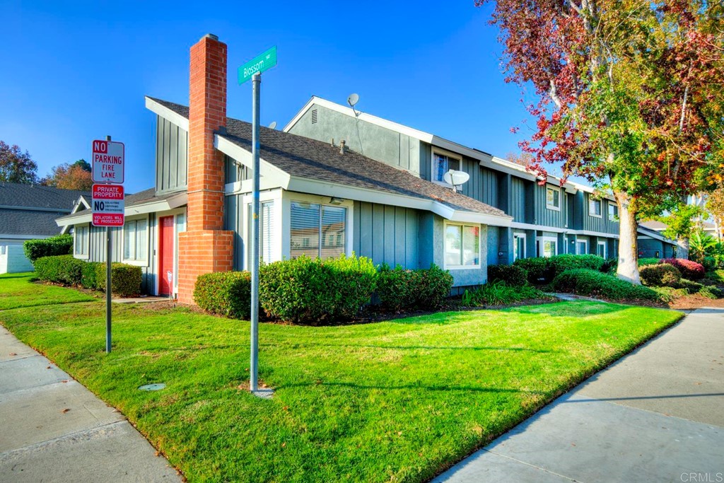 249 Fredricks Avenue Oceanside, CA 92058 - Photo 3 of 31 a front view of a house with a yard