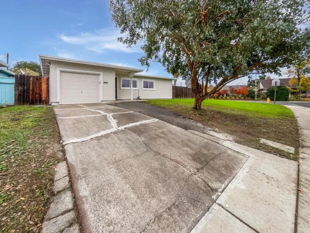 a house with yard in front of it