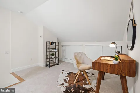a view of a workspace with furniture