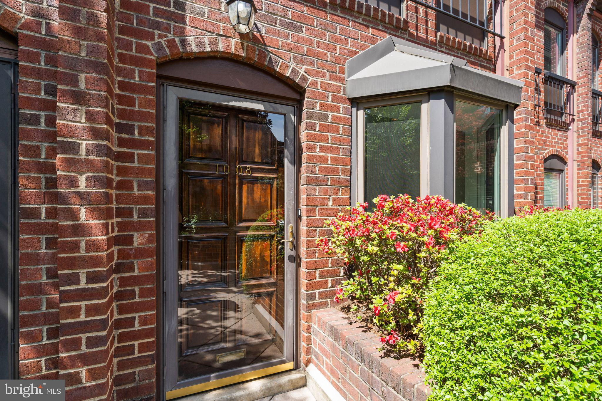 1008 Paper Mill Court, Unit 1008 Washington, DC 20007 - Photo 2 of 31 a front view of a house with a glass door