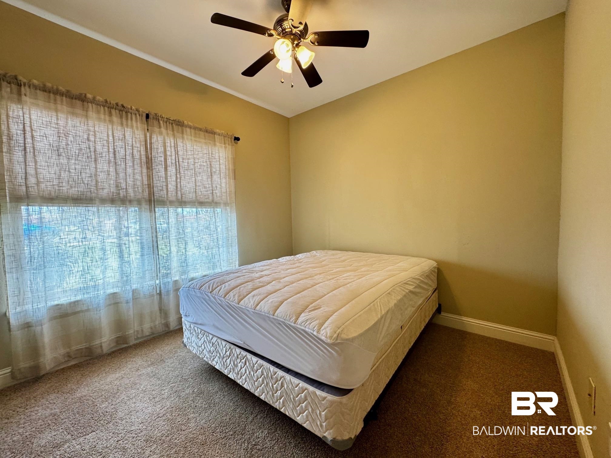 1030 Crown Walk Drive Foley, AL 36535 - Photo 20 of 40 Bedroom featuring baseboards, carpet floors, and ceiling fan
