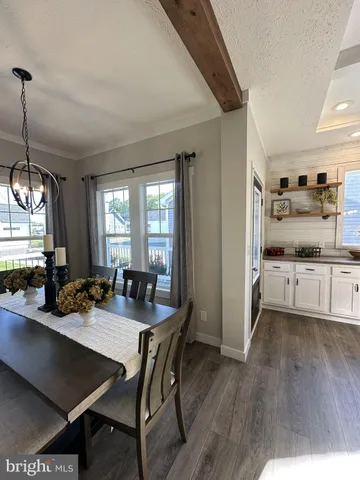 a view of hallway with wooden floor