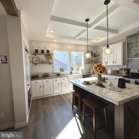 a kitchen with a table and chairs in it