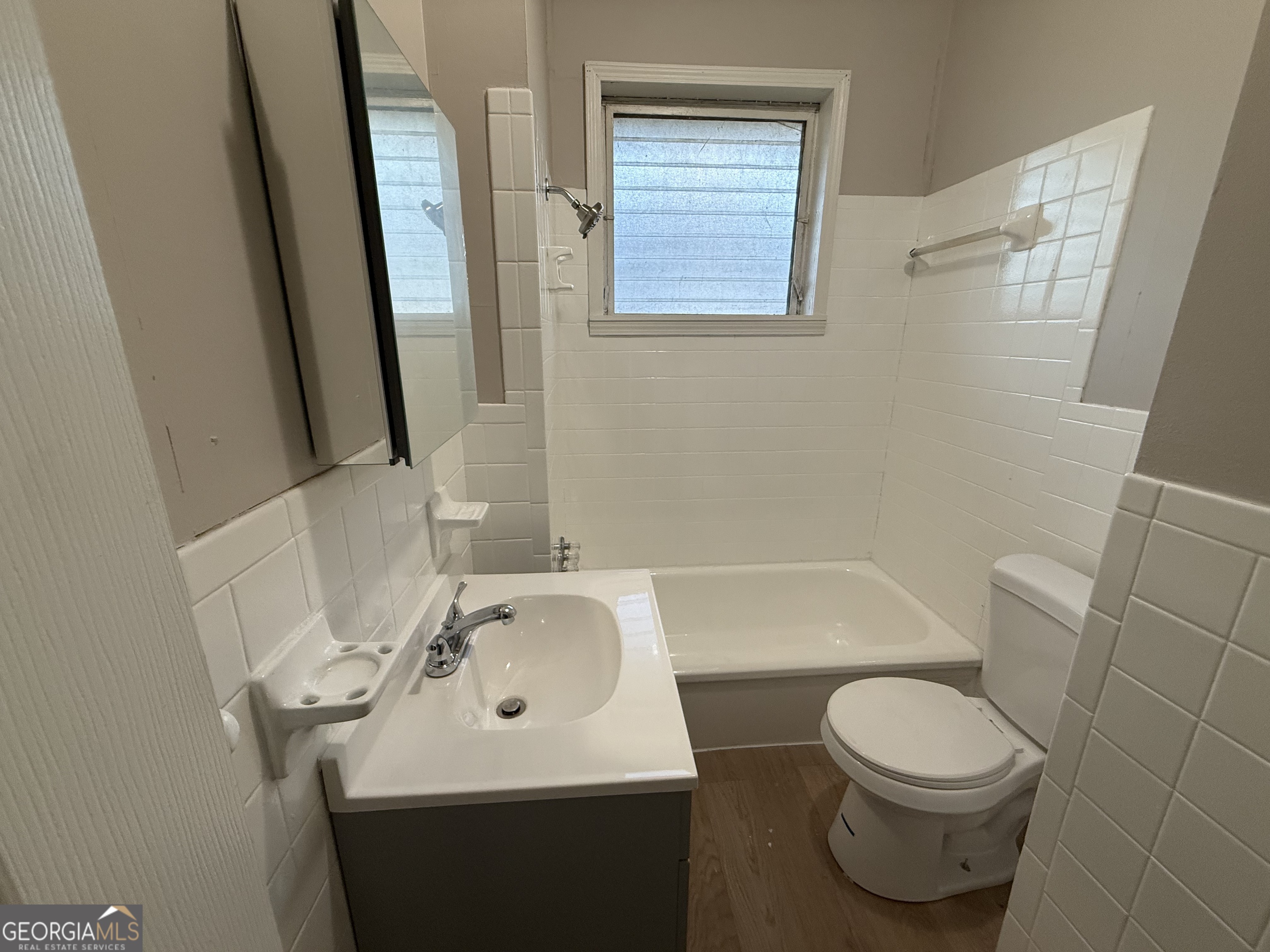75 3rd Shannon Street Northeast Rome, GA 30161 - Photo 12 of 14 a bathroom with a sink a toilet and a mirror
