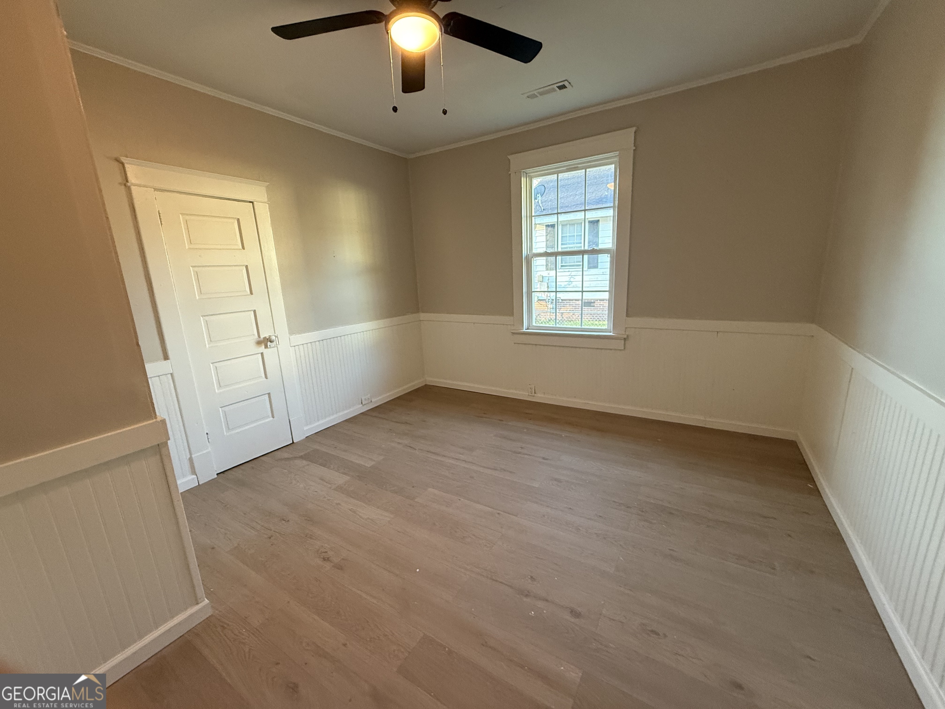 75 3rd Shannon Street Northeast Rome, GA 30161 - Photo 13 of 14 an empty room with chandelier fan and windows