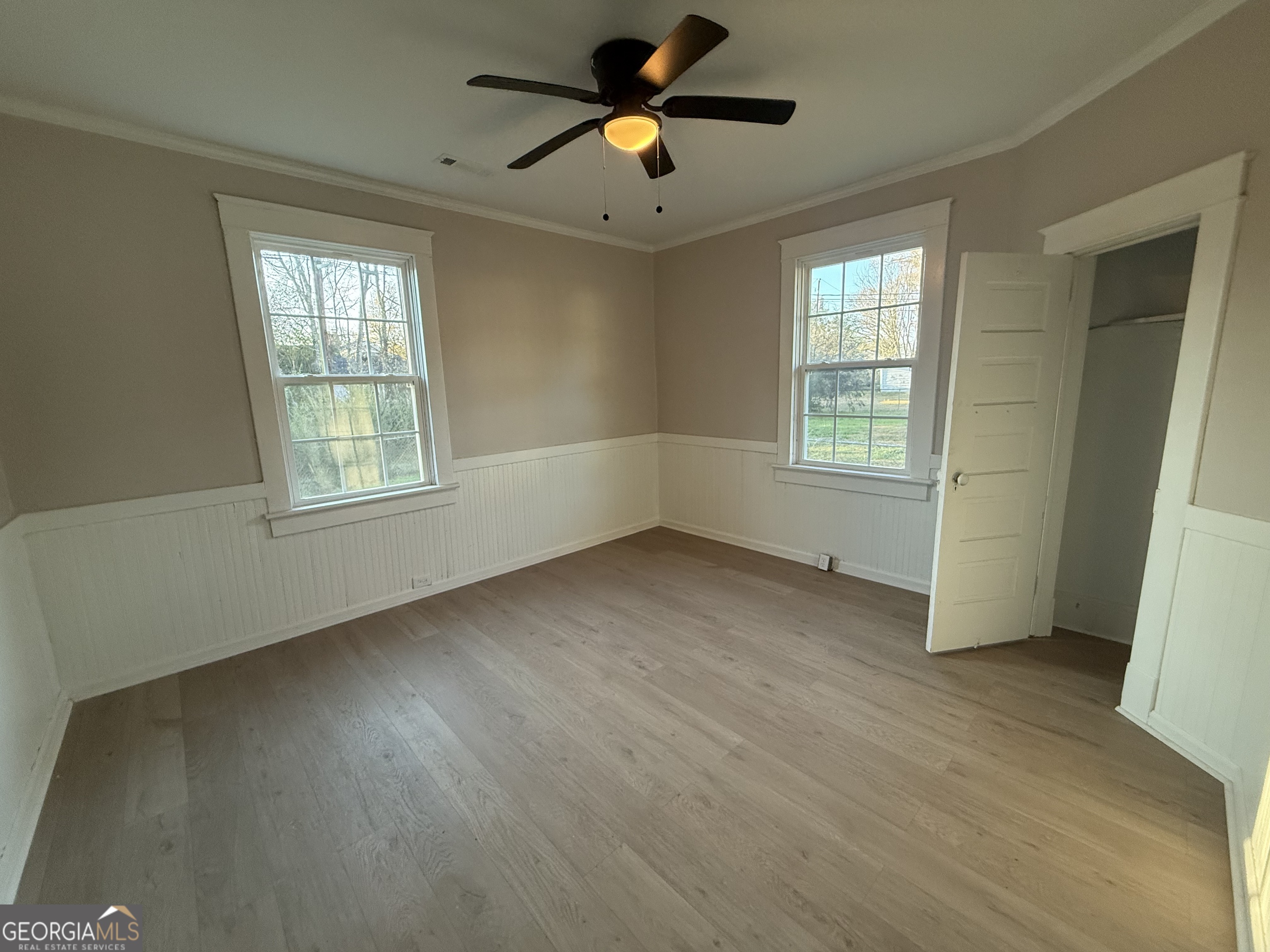 75 3rd Shannon Street Northeast Rome, GA 30161 - Photo 10 of 14 a view of empty room with wooden floor and fan