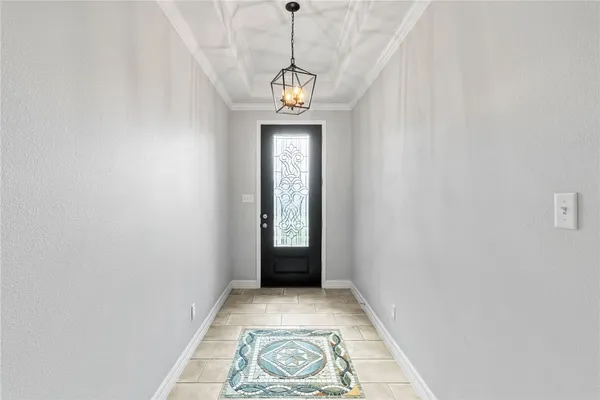 a view of a hallway with wooden door