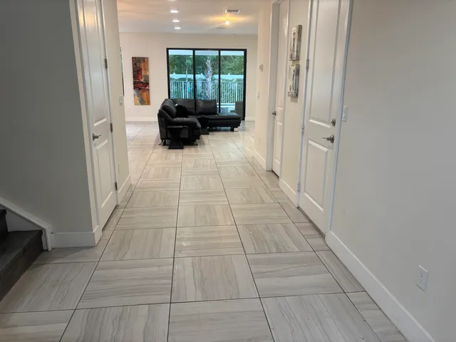 a view of livingroom with furniture and a rug