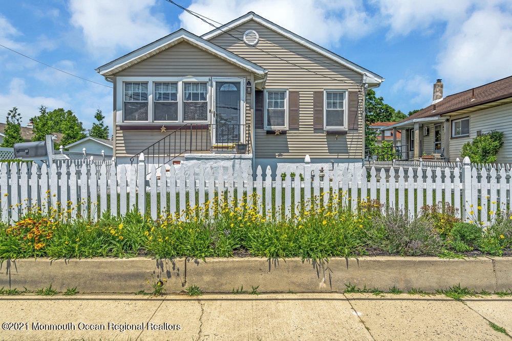 front view of a house with a small yard