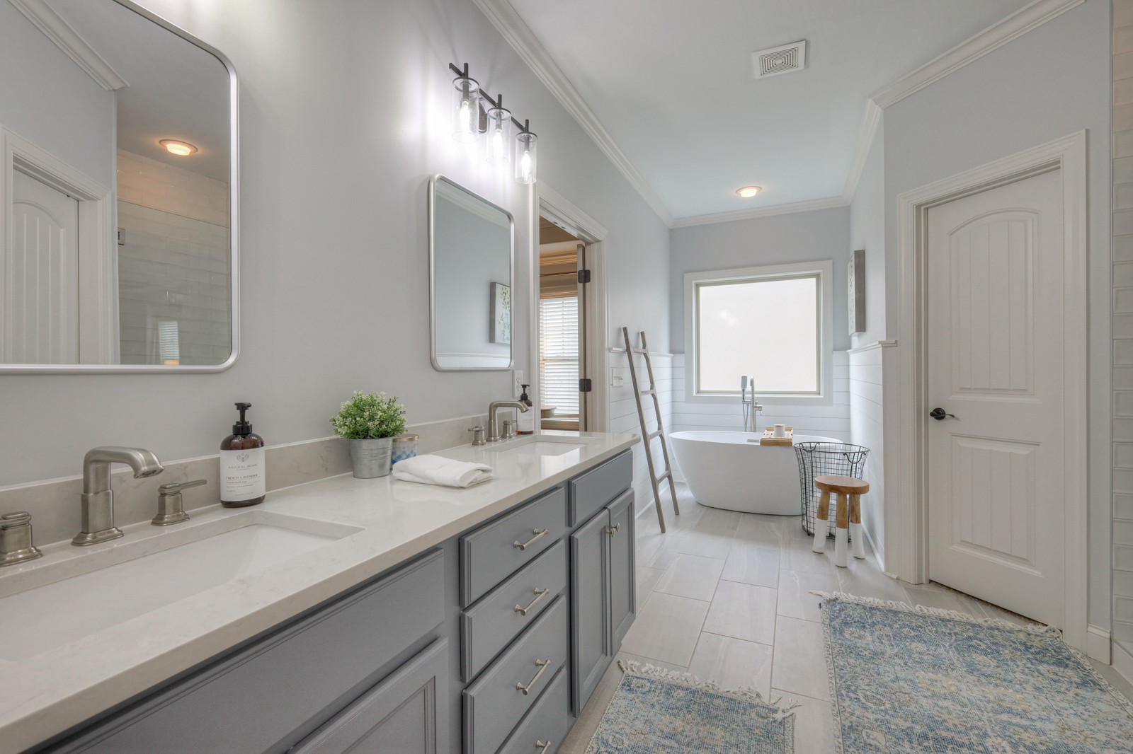 7020 Brindle Ridge Way Spring Hill, TN 37174 - Photo 15 of 42 a spacious bathroom with a sink a mirror and a bathtub