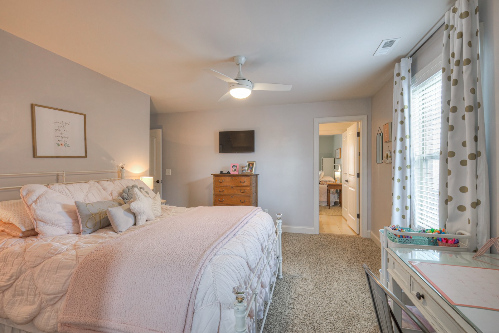 7020 Brindle Ridge Way Spring Hill, TN 37174 - Photo 28 of 42 a bedroom with a large bed and a large mirror