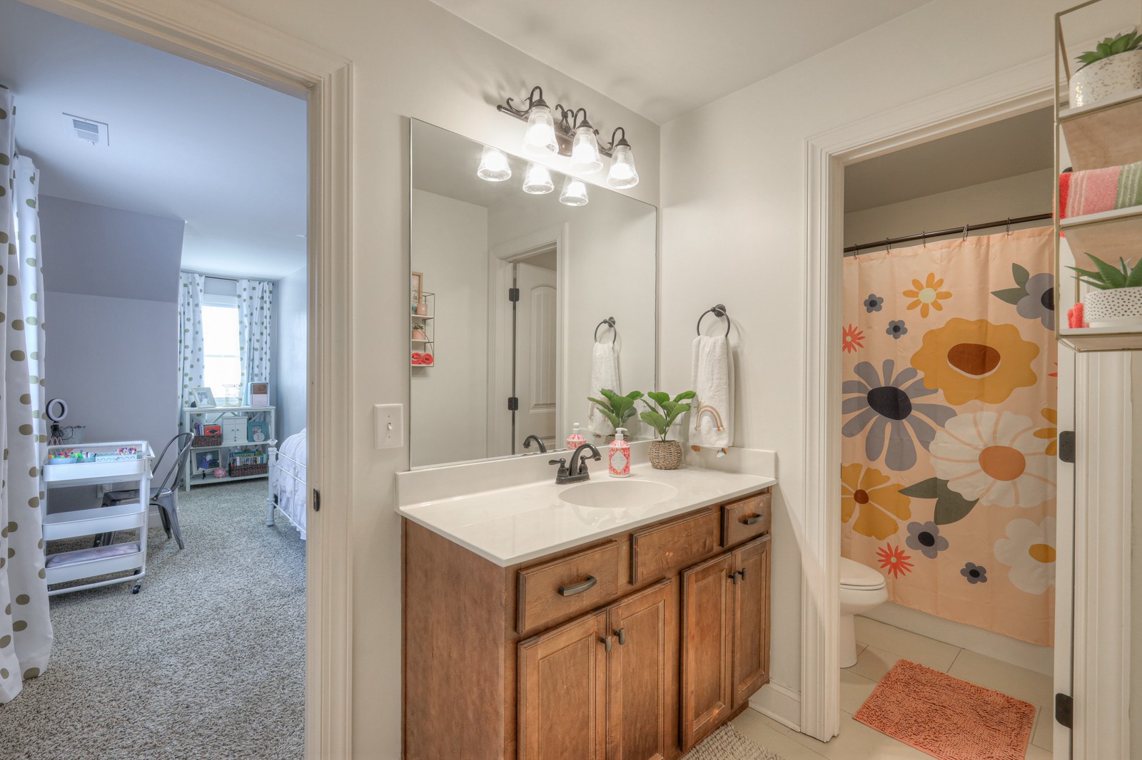 7020 Brindle Ridge Way Spring Hill, TN 37174 - Photo 29 of 42 a bathroom with a double vanity sink mirror and shower