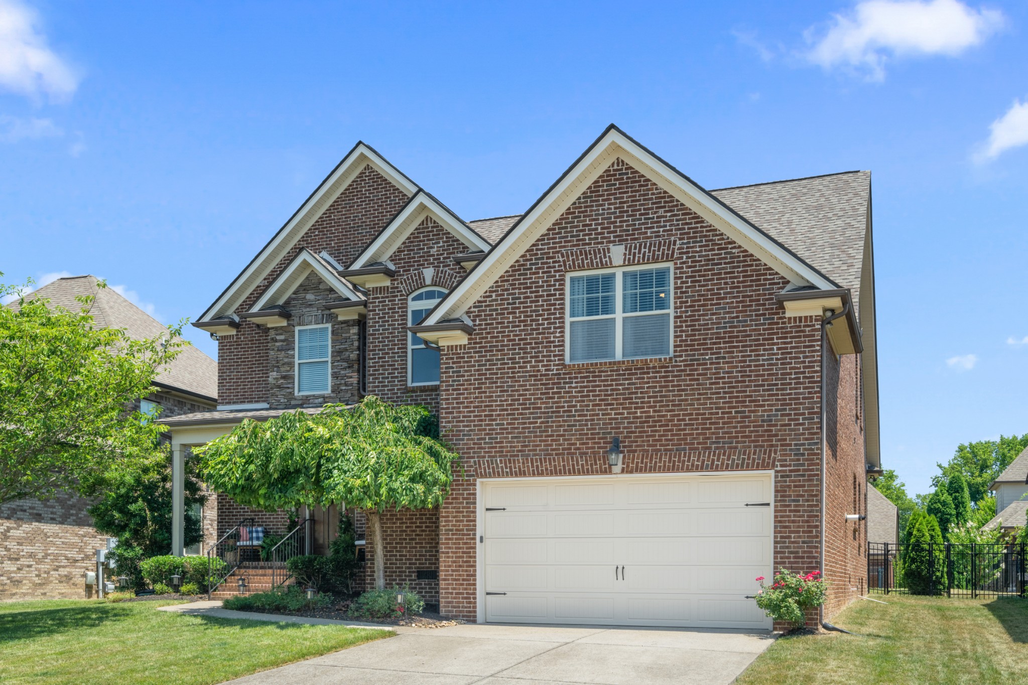 7020 Brindle Ridge Way Spring Hill, TN 37174 - Photo 3 of 42 a front view of a house with a yard