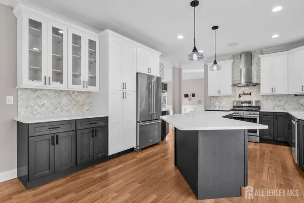 a kitchen with a sink a counter and cabinets