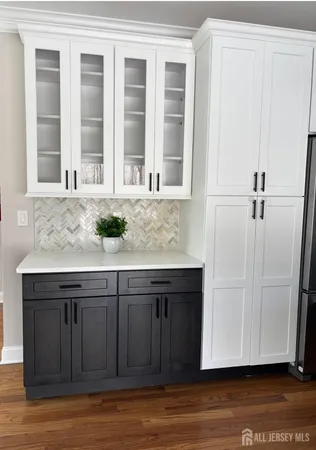 a kitchen with a sink and cabinets