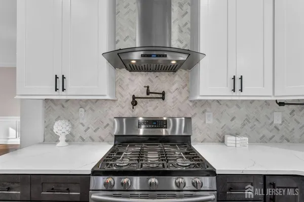 a view of an empty room with a fireplace and a window