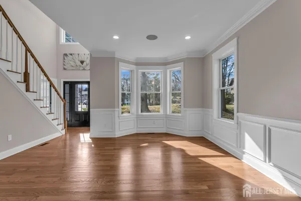 a view of an entryway with wooden floor