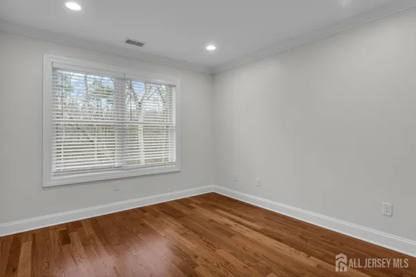 an aerial view of a house with garden space and street view