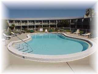 3605 Hwy Santa Rosa Beach, Unit 223 30A Santa Rosa Beach, FL 32459 - Photo 3 of 8 a view of a swimming pool with a table and chairs