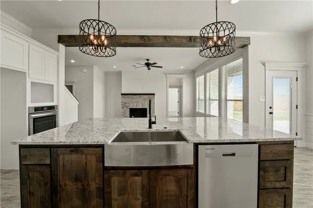 a kitchen with a counter space cabinets and appliances