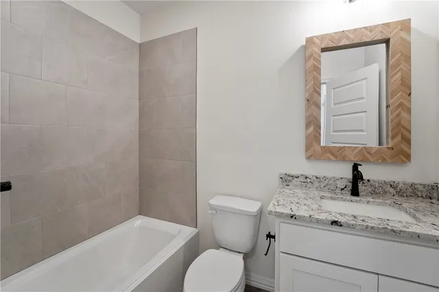 an empty room with windows and cabinet