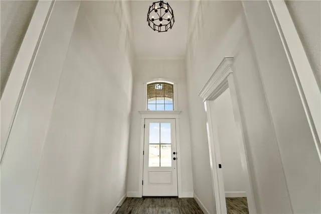 a view of an entryway with wooden floor