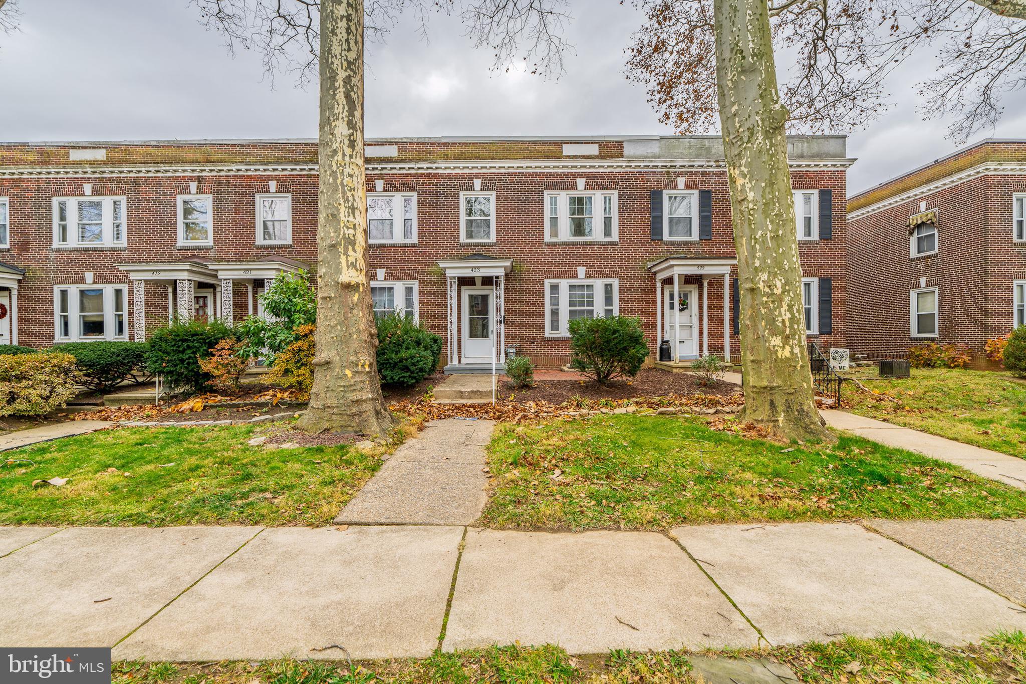 423 Sunset Road Reading, PA 19611 - Photo 1 of 39 a front view of a residential apartment building with a yard