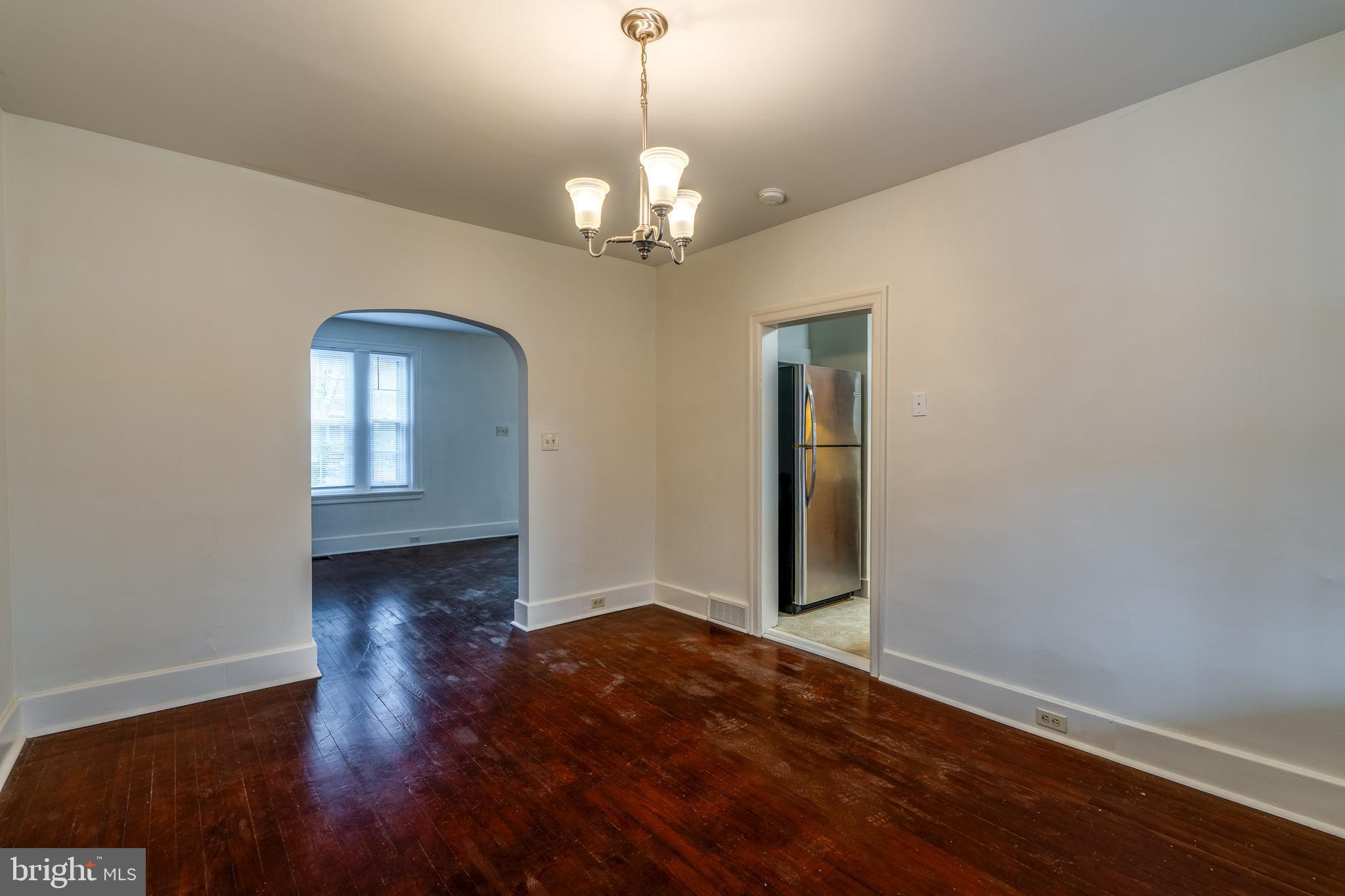 423 Sunset Road Reading, PA 19611 - Photo 17 of 39 wooden floor in an empty room with a window