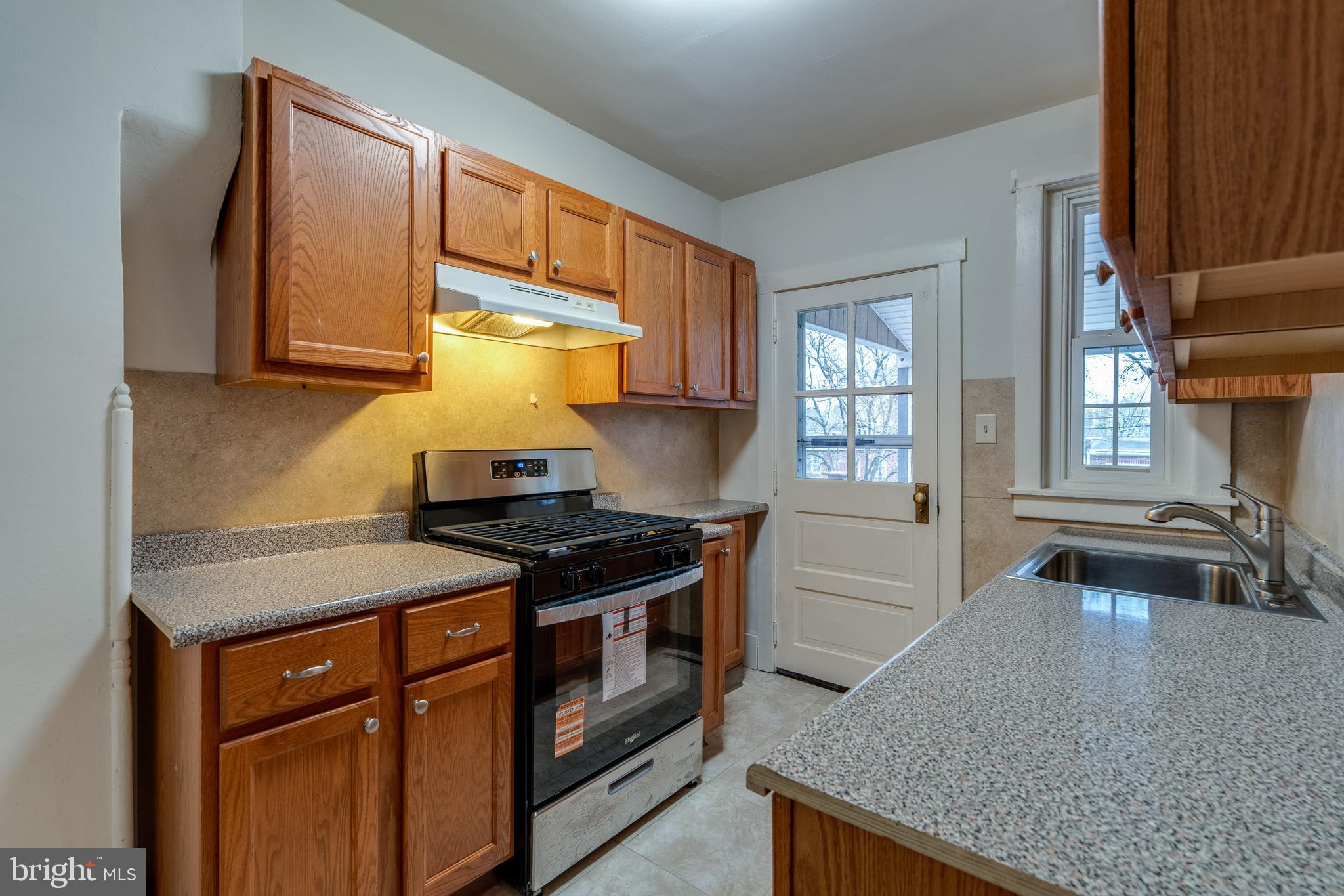 423 Sunset Road Reading, PA 19611 - Photo 18 of 39 a kitchen with a stove and a sink