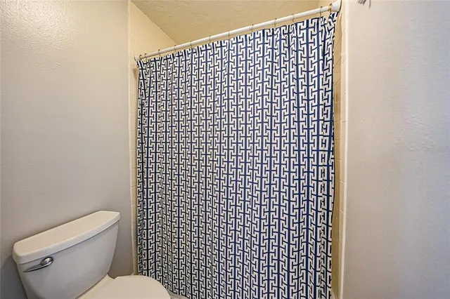 a bed room with a bed and a window